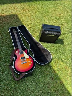 Epiphone Les..Paul-100 electric guitar heritage Cherry sunburst…. with U line amp.$300
