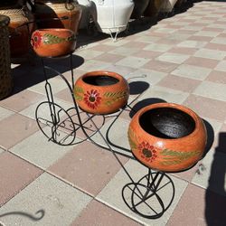 New Bike With Flower Pots Made Out Of Clay And Iron 