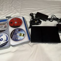 Sony Playstation 2 Slim with game lot 