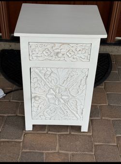 Carved wooden end table with power strip $50
