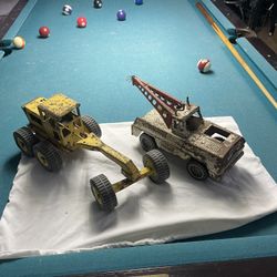 Two Old Metal Trucks 