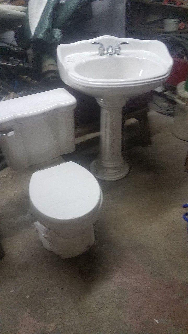 Pedestal Sink And Matching Toilet