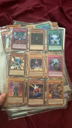 A bunch of yu gi oh cards