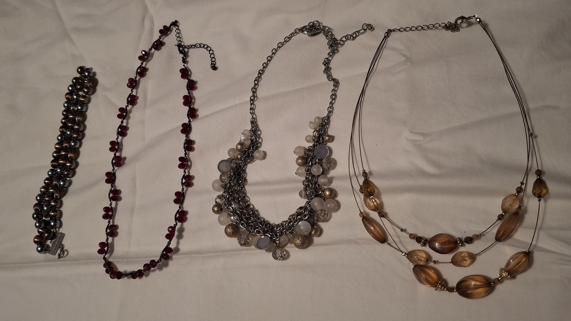 Three Necklaces And A Bracelet