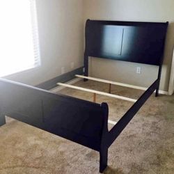 queen size black wood sleigh bed frame.