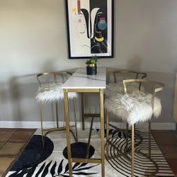 Gold and white faux marble bar table set with 2 stools
