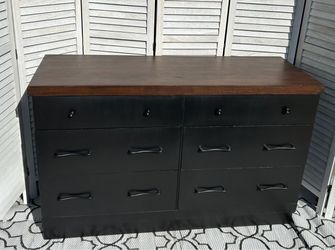 6 drawer Black dresser with dark walnut top.
