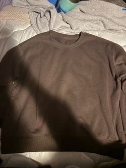 brown sweater. the size is rubbed off but i believe it's a large.