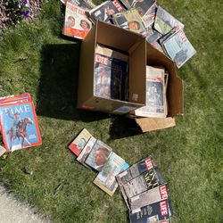 boxes of JFK and Moon landing magazine and newspapaer. 