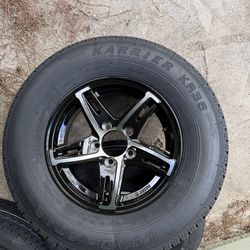 New 205-75-14inch trailer tires with black aluminum wheels.  In stock  Loadstar