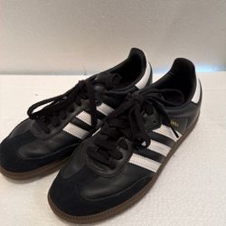 Adidas Samba OG sneakers in the Core Black and Cloud White colorway. $75