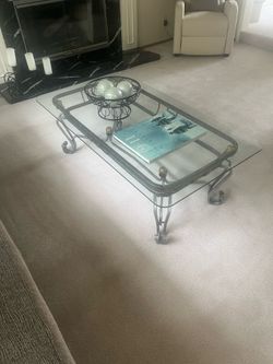 Two glass tables. Two lamps.
