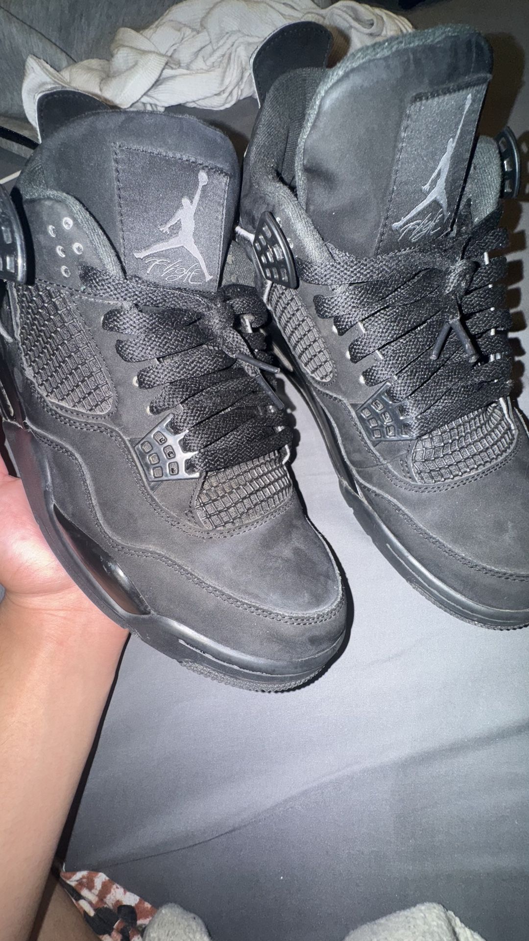 Black cat jordan 4s