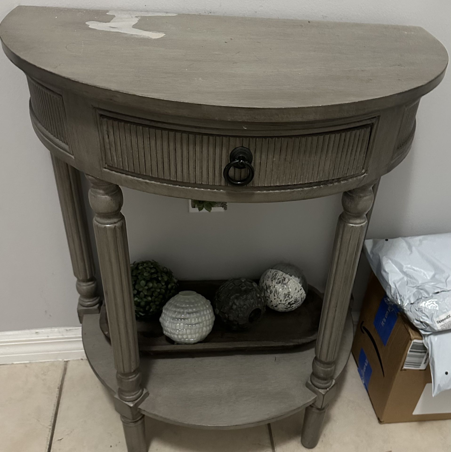 Gray Small Table With Stain On Top