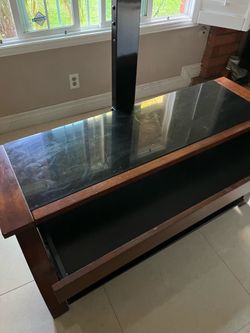Tv stand 50 wide x 15 deep x24 high used .. good condition.