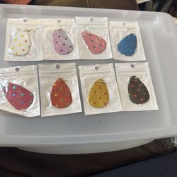 Set of sparkly teardrop earrings with tiny heart confetti. Glitter finish in multiple colorways. Lightweight with fishhook ear wires. Great for playfu