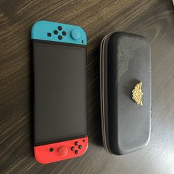 Nintendo Switch OLED + Case + Games included in photos