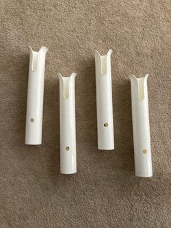 Four polyethylene single rod holders.