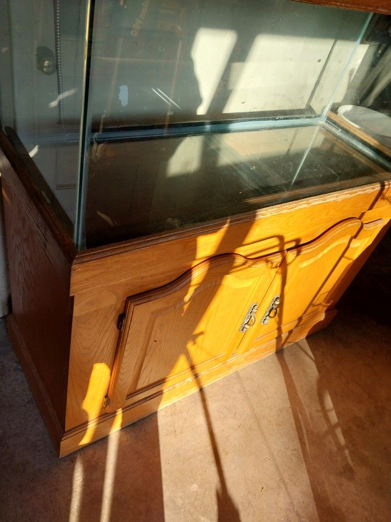 75 gallon aquarium with oak stand and canopy.