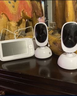 baby monitor 2 cameras with 180 degree rotation in the communicator you can hear sounds and can speak through the communicator