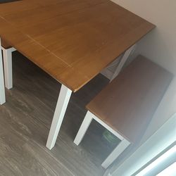 Beautiful table, with two benches that fit under the table when not in use. Excellent condition .
