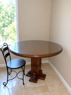 Solid wood round table with glass top