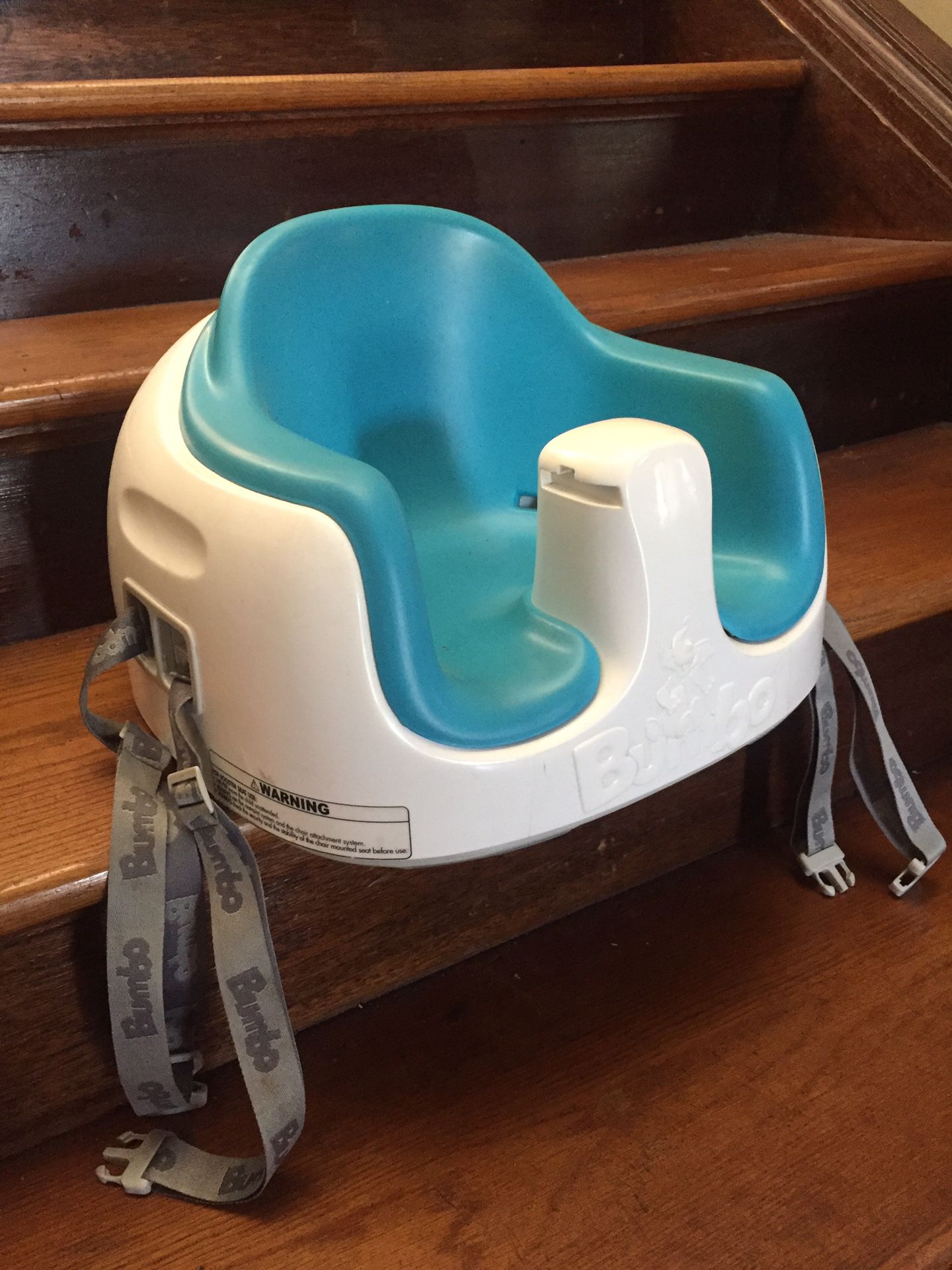 Bumbo booster seat with chair straps
