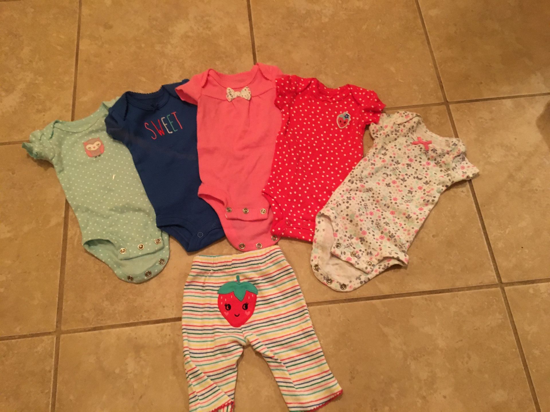 Four onesies size premie with pants