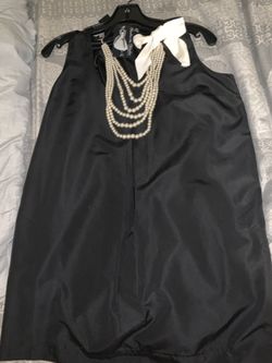 Brand new mini dress with pearls and a bow