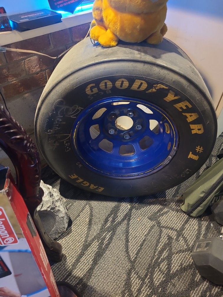 Autographed Richard Petty Race Used Tire W Damage And Lugs
