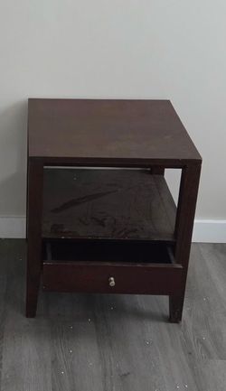 Brown wood nightstand with drawer