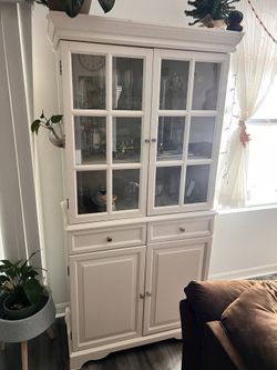 white wooden china cabinet