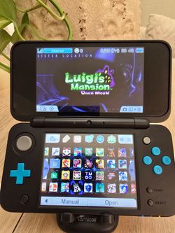 'New' Nintendo 2DS XL + 128GB microSD Card – $280