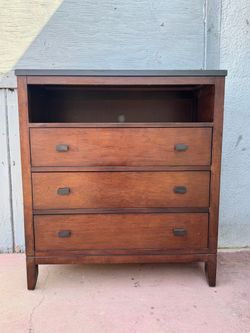 Tall dresser with three drawers in very good condition all drawers open just fine