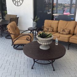 Outdoor living room set with two and tables and coffee table