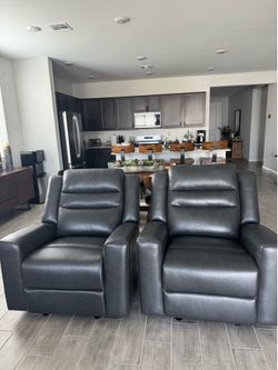 Set of 2 brand new leather recliners.