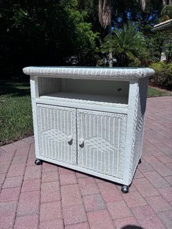 Vintage white wicker tv stand / cabinet on wheels