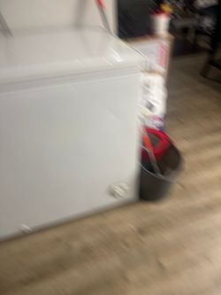 Deep freezer and marble table with no chairs