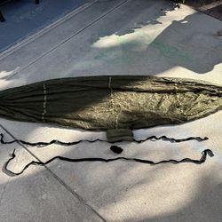 Portable hammock with bug screen, folds into a small pouch.