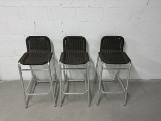 wicker-style back bar stools with chrome or aluminum metal legs