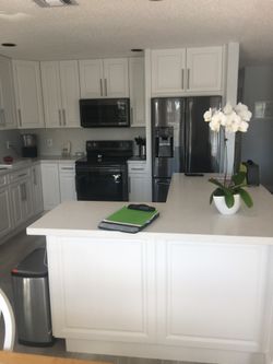 Kichen Cabinet/ Countertops/ Laminate Flooring And Closet.  