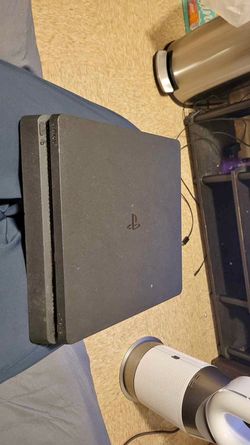 PS4 Slim 1TB + 8 Physical Games - Excellent Condition