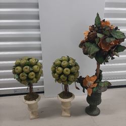 Sell all three.  Green apple topiary tree $16.00 each
Holiday topiary tree in urn vase $28 