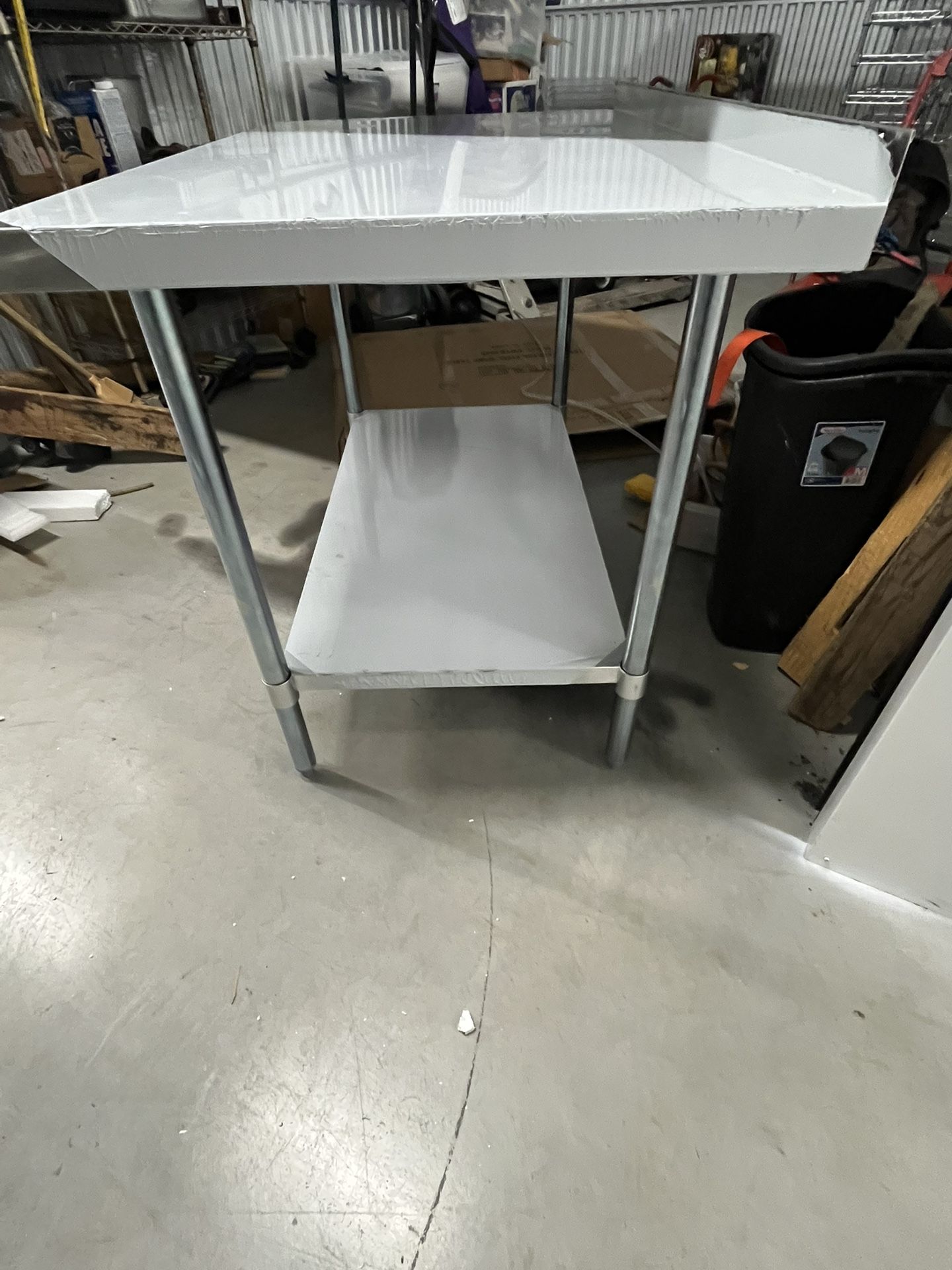 Stainless Steel Work Table 48W X 30D X 35H with 2” backsplash 