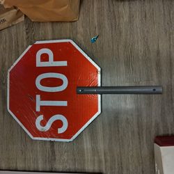 Stop Slow Sign And Fluorescent Vest