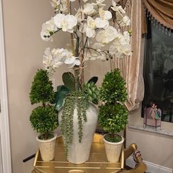 Beautiful, gorgeous, artificial flowers with the clay vase for all three pieces