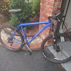 Gravity hardtail mountain bike with Rockshox suspension and Smith helmet
