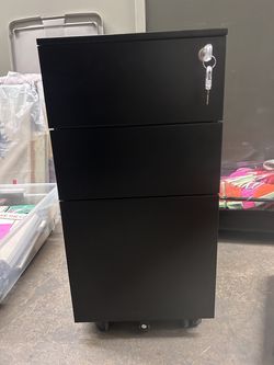 Small file cabinet and keys.