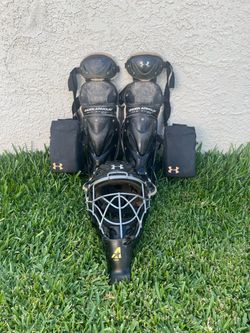 Under Armour Baseball Catcher's leg guards and helmet