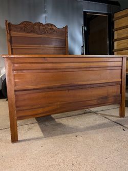 Beautiful antique Victorian-style wooden bed frame full size